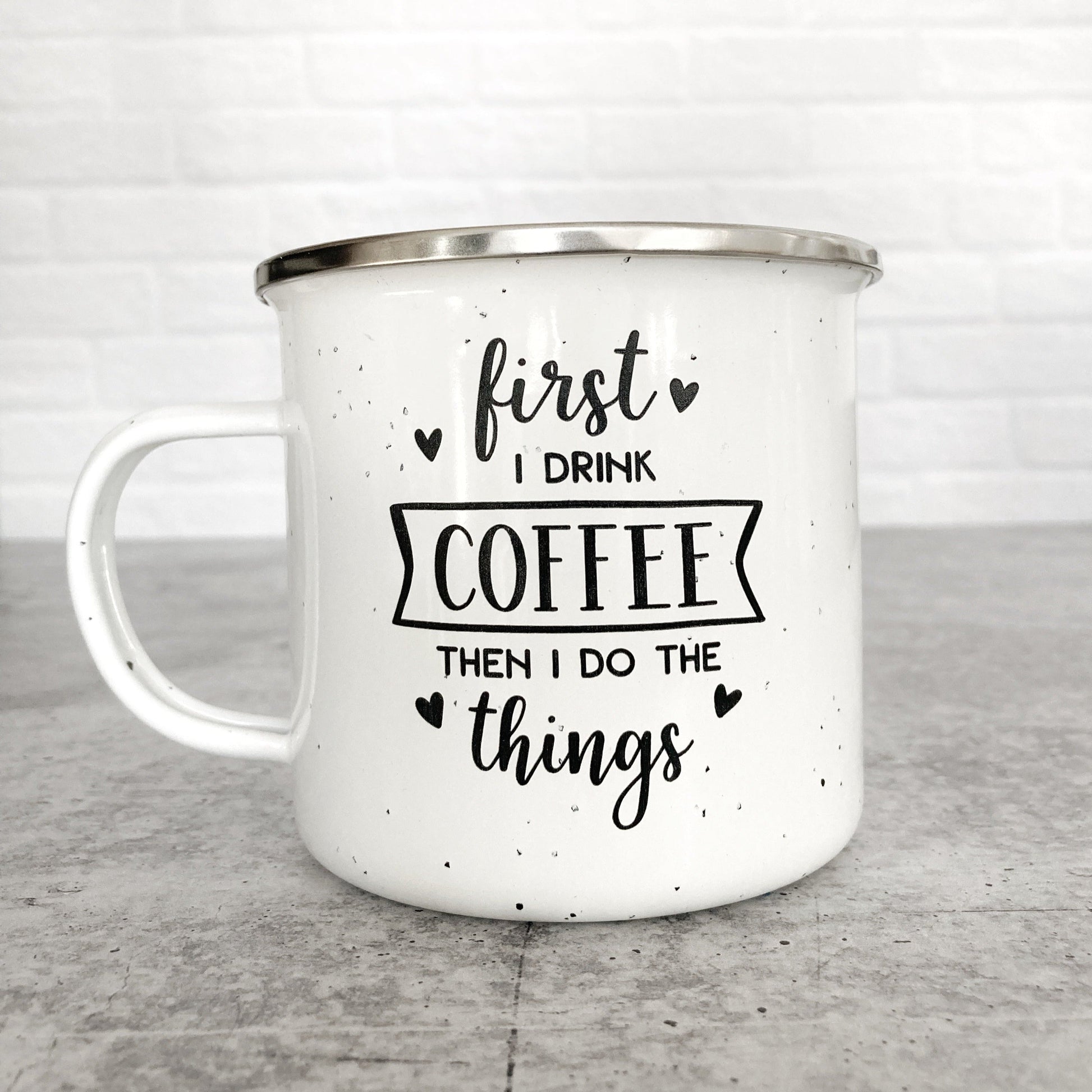 First I Drink the Coffee Then I do The Things Design on a white enamel mug