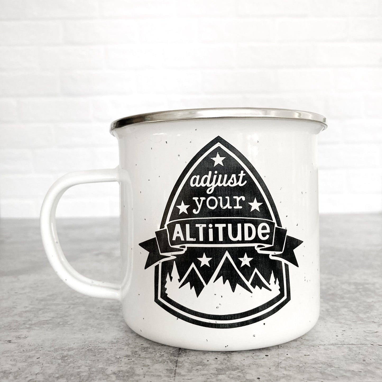 Adjust Your Altitude Design on a white enamel mug