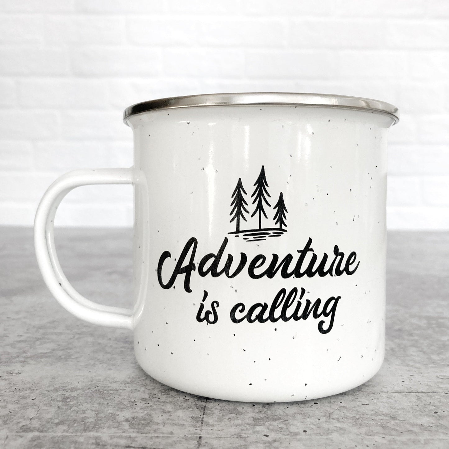Adventure Is Calling Design on a White Enamel Mug
