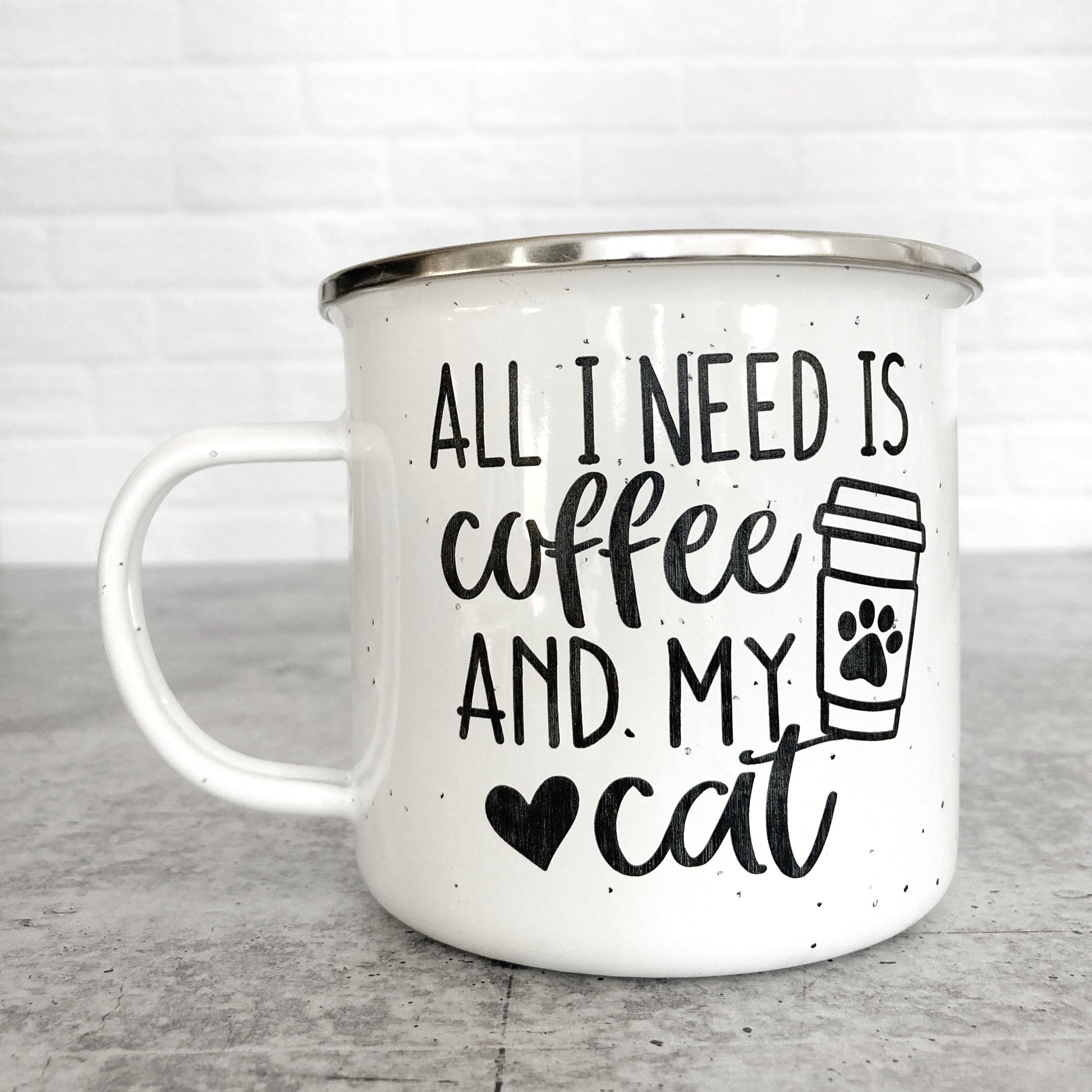 All I Need Is Coffee And My Cat design on a white enamel mug