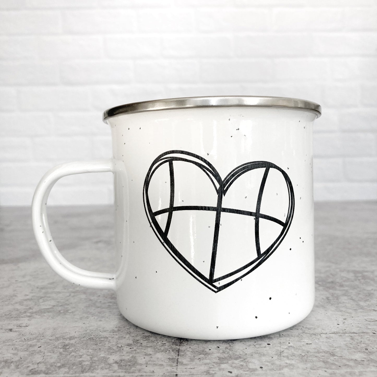 Basketball heart design on a white enamel mug