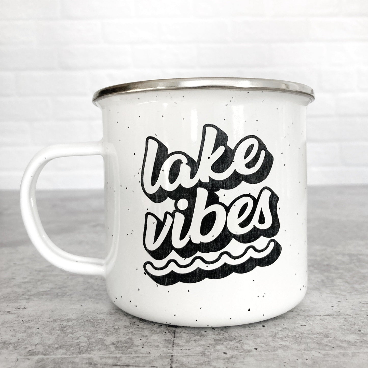 Lake Vibes design on a white enamel mug