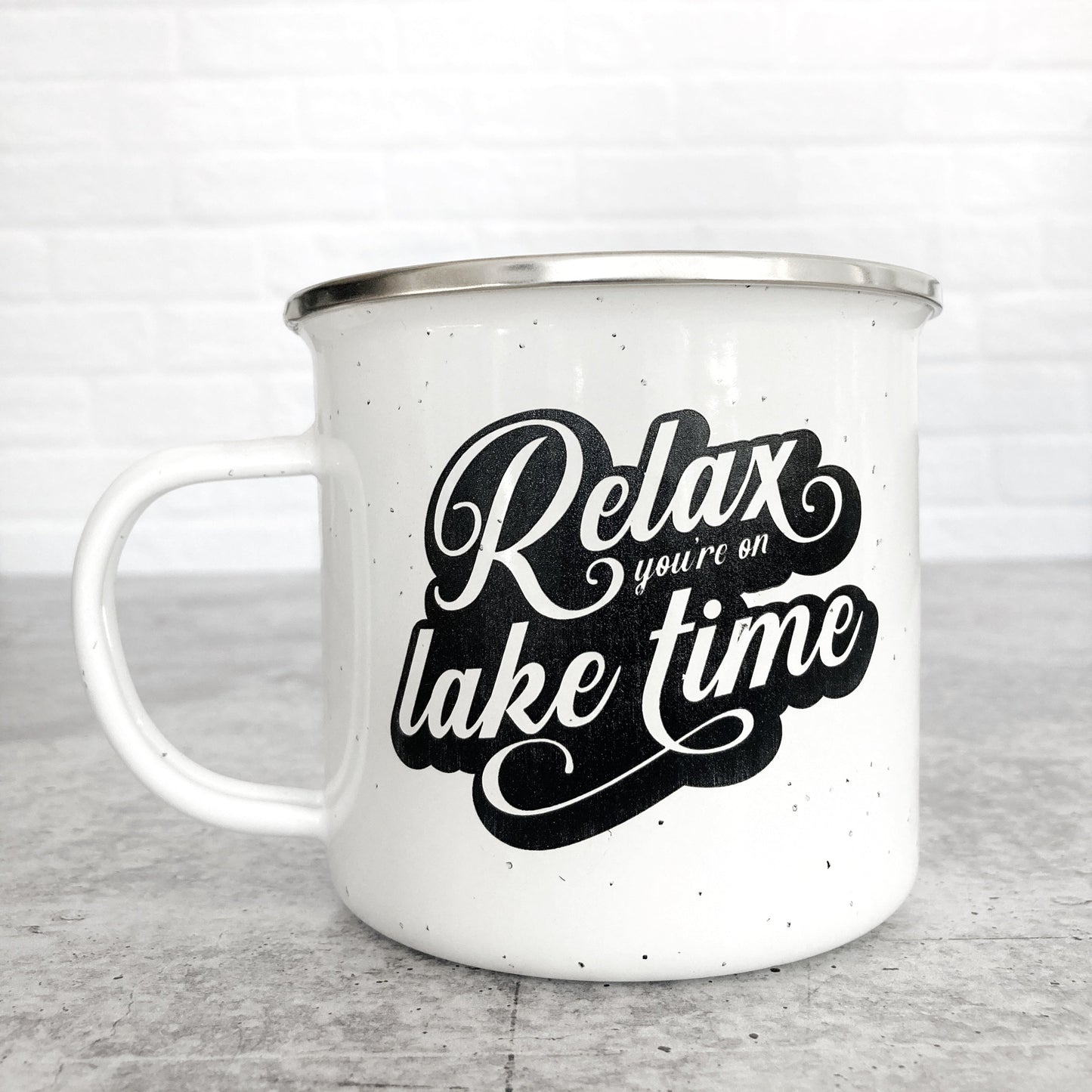 Relax You're on Lake Time Design on a white enamel mug