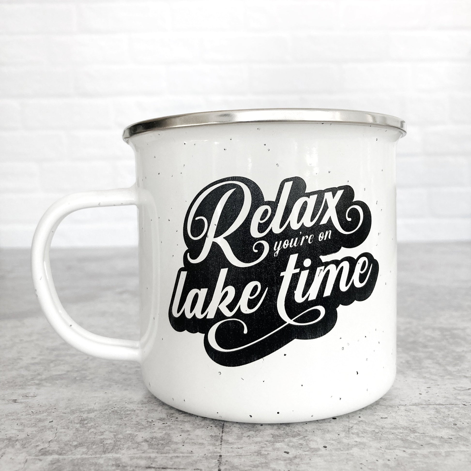 Relax You're on Lake Time Design on a white enamel mug