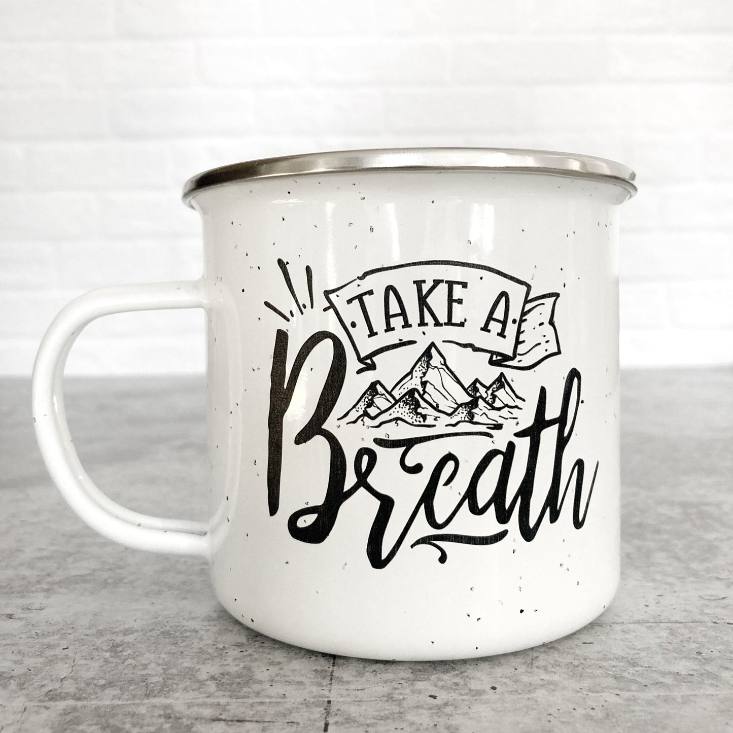 Take A Breath Mountain Design on a white enamel mug