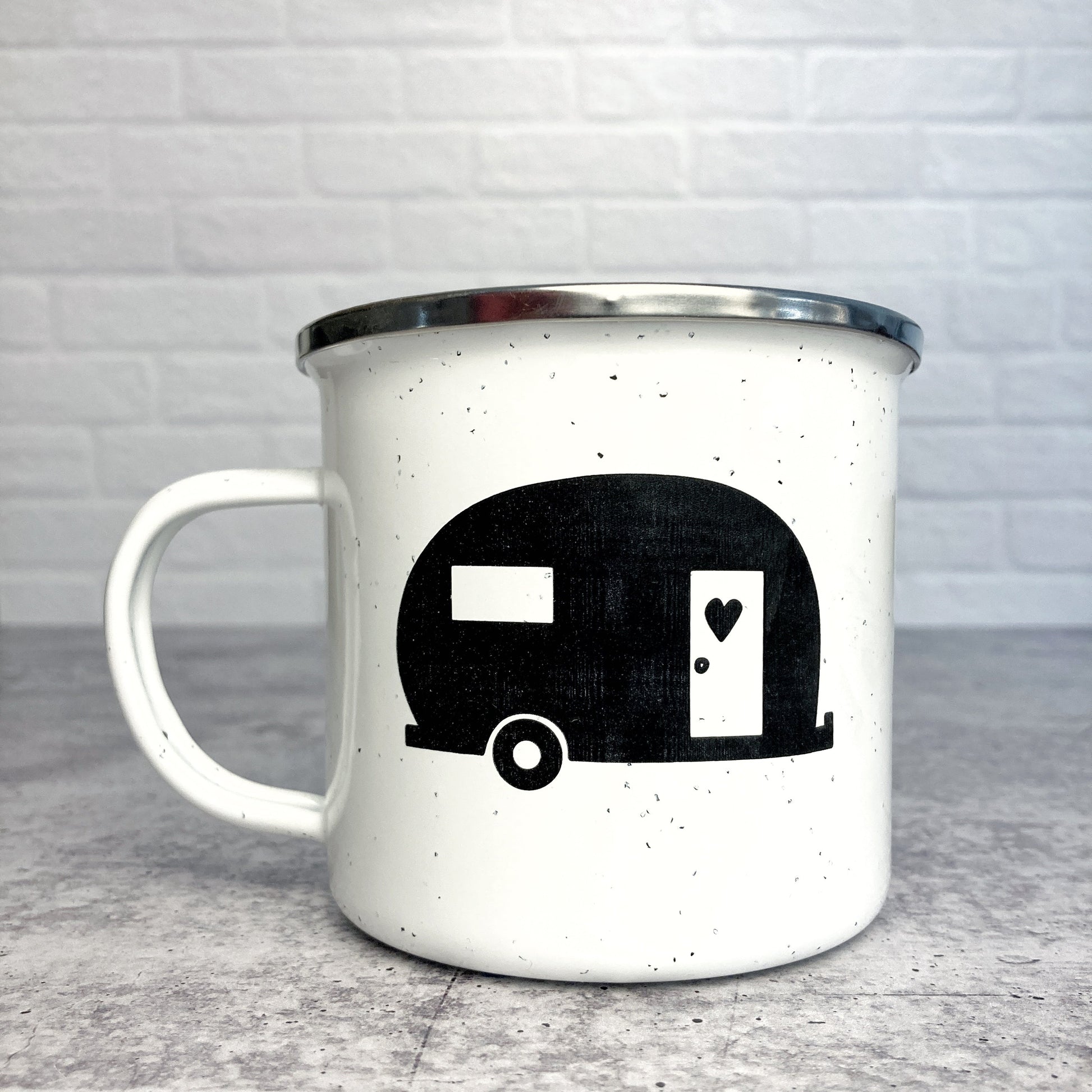 Vintage Camper design on a white enamel mug