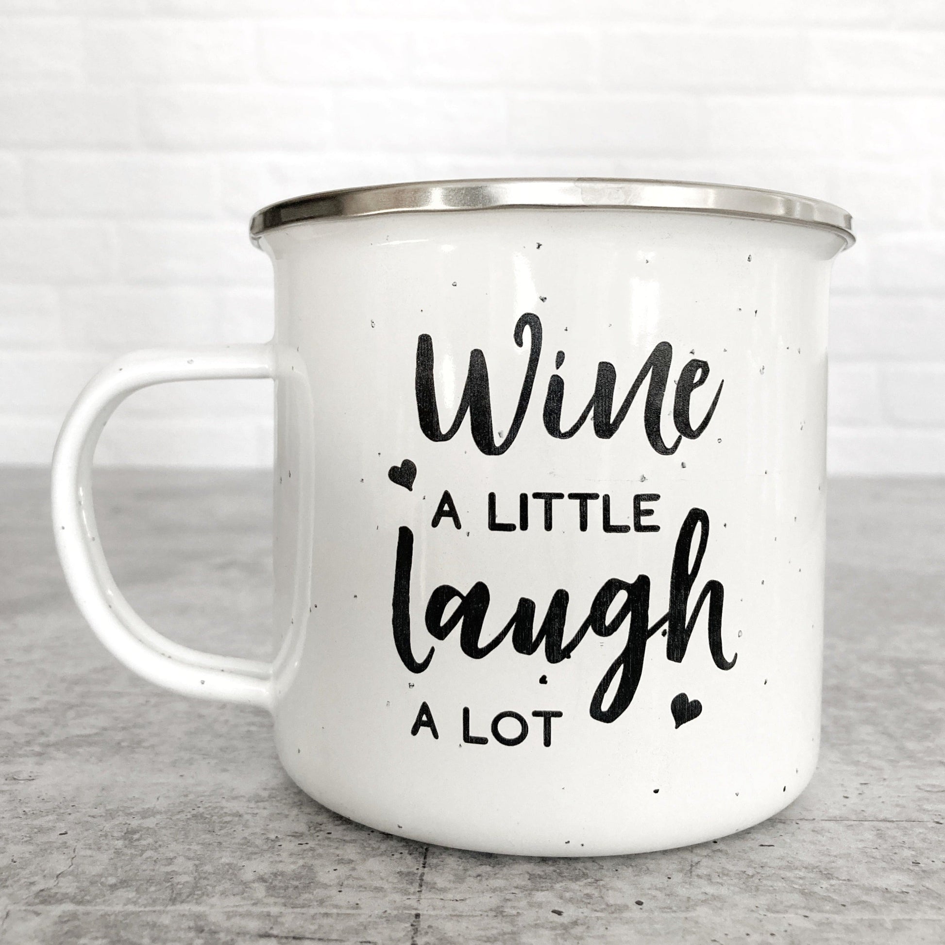 Wine A Little Laugh A Lot design on a white enamel mug